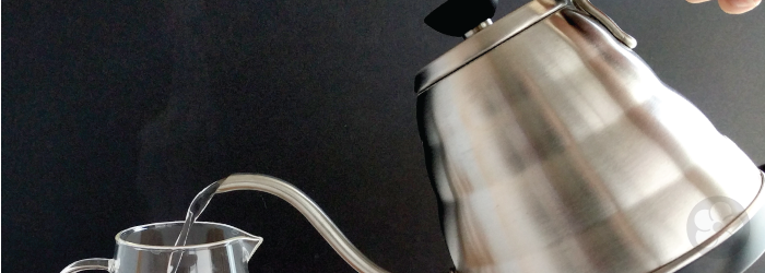 Pouring hot water into an empty server can help cool it before starting to brew tea leaves.