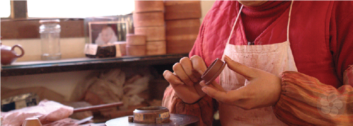 yixing teapots are carefully formed by hand without use of a potter's wheel